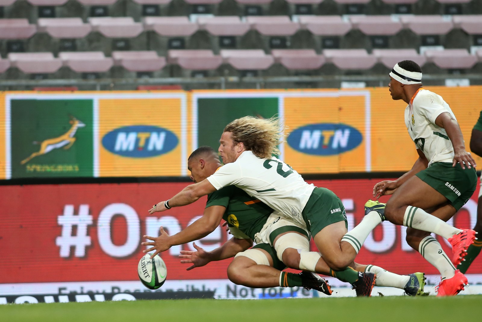 Juarno Augustus seals the deal for Green with a late try despite Werner Kok's best defensive efforts.