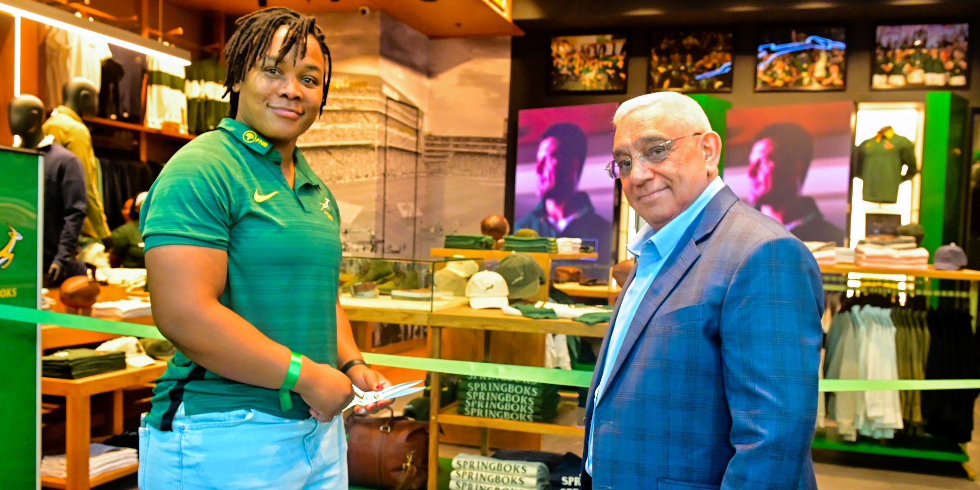 Babalwa Latsha and Mr Mark Alexander cut the ribbon to officially open the Springboks store in Cape Town.