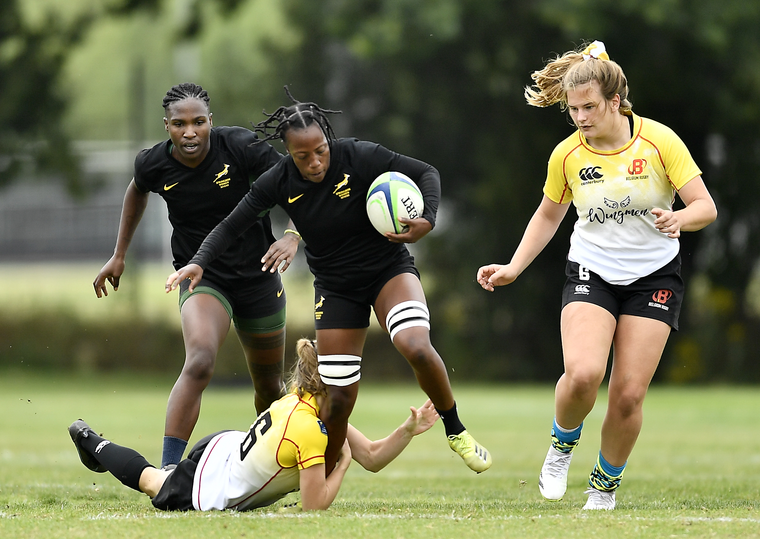 Kemisetso Baloyi on the attack against Belgium, with Ayanda Malinga in close support.