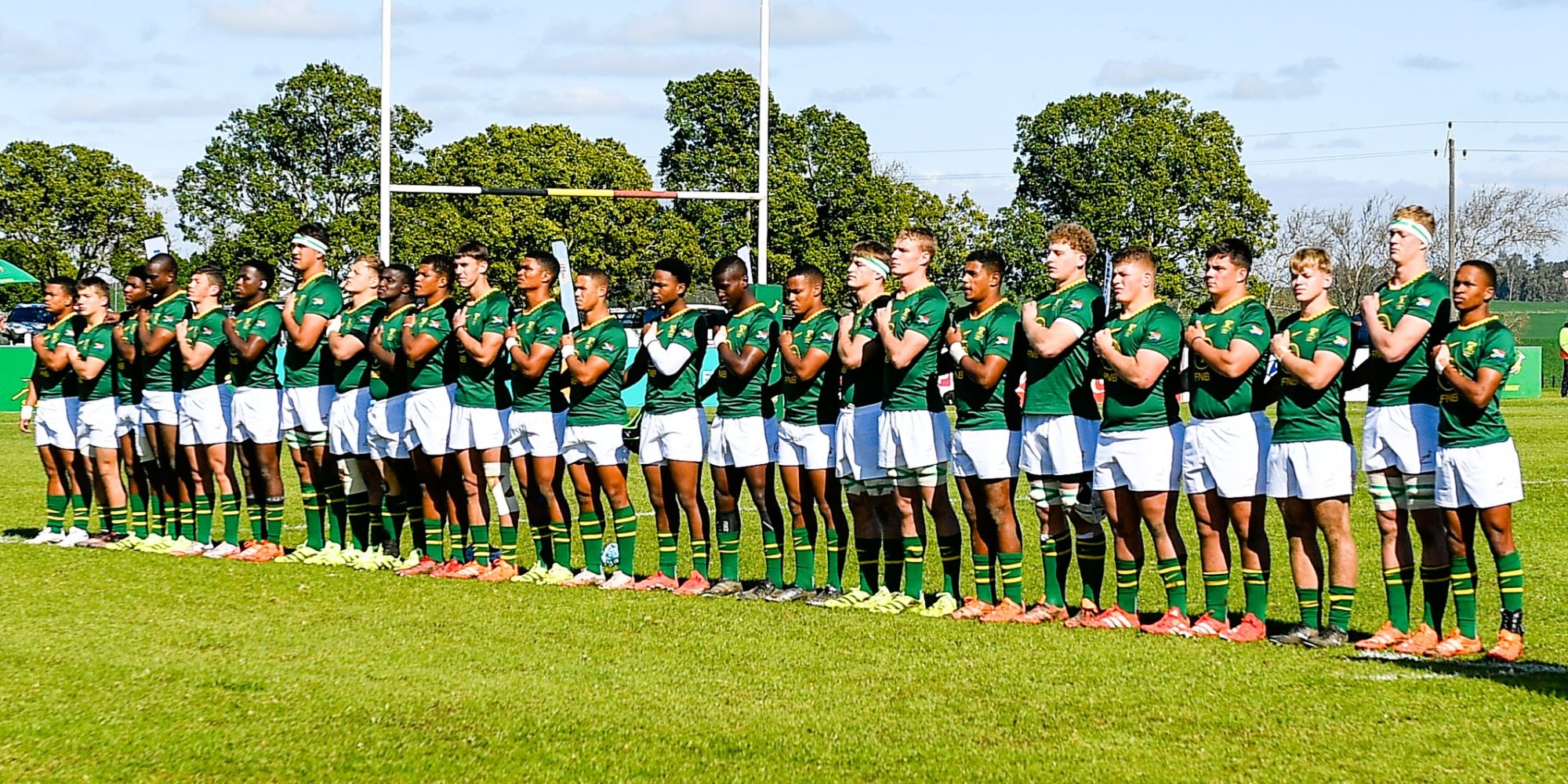 The SA U18 'A' team line up for the anthem before taking on Georgia.