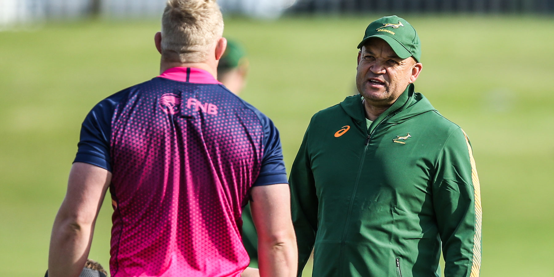 Deon Davids in coversation with Vincent Koch on the training field.